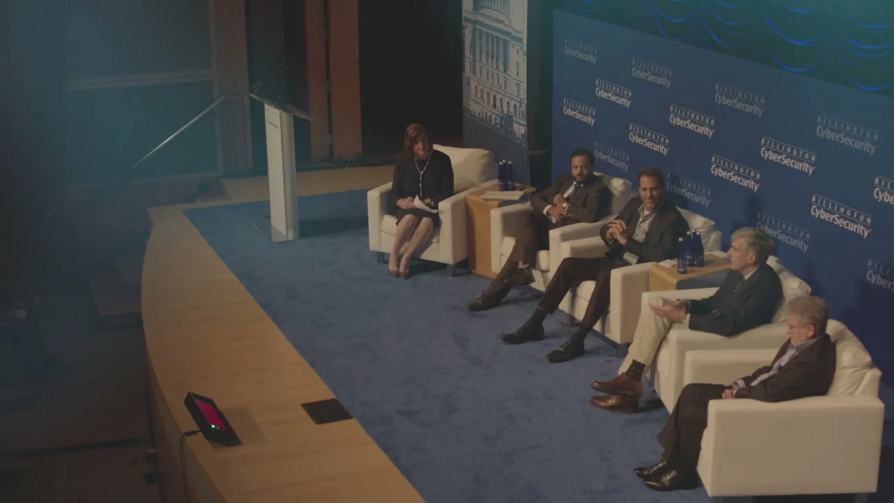 Panel discussion on a summit stage